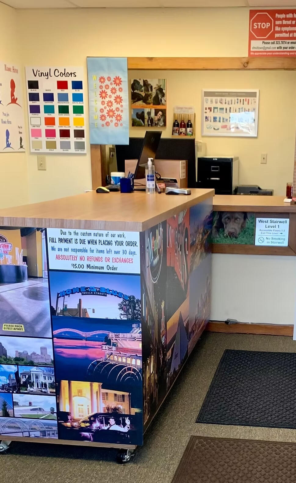 Interior of Signs First Midtown showing the service counter and vinyl color samples